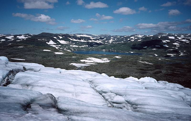 August 5, 1997 - From Finse to the Hardangerjkulen (glacier) and back, Norway.<br />Lake and Finse from the glacier.