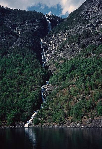 August 6, 1997 - In and around Flam, Norway.<br />A fjords tour to Gudvangen and back.<br />Waterfall in the Naeryfjorden.