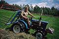 August 8, 1997 - On Torger's farm, Geilo, Norway.<br />Torger tooling around in his tractor.