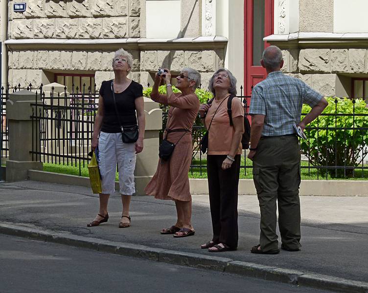 Daina, Baiba, Joyce, and Ronnie admiring the buildings along Vidus iela (Middle Street).<br />June 1, 2011 - Riga, Latvia.