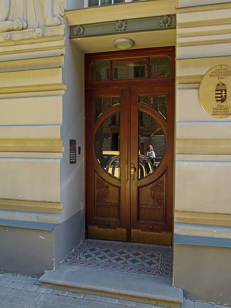 Door to the Hungarian Embassy on Alberta Street.<br />Reflection of Betsy in the glass.<br />June 5, 2011 - Riga, Latvia.