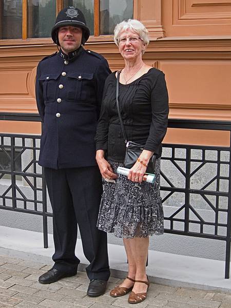 Daina posing with a local policeman.<br />June 12, 2011 - Riga, Latvia.