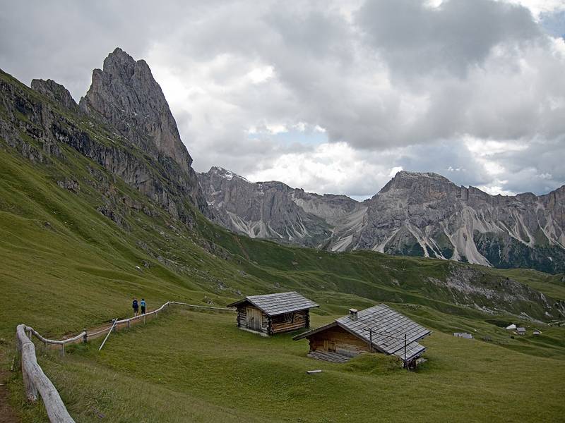 We are heading for the notch on the horizon below the clouds in the middle of the photo.<br />Hike from Seceda cable car terminal to Puez hut.<br />July 26, 2011 - NE of St. Ulrich/Ortisei, Italy.