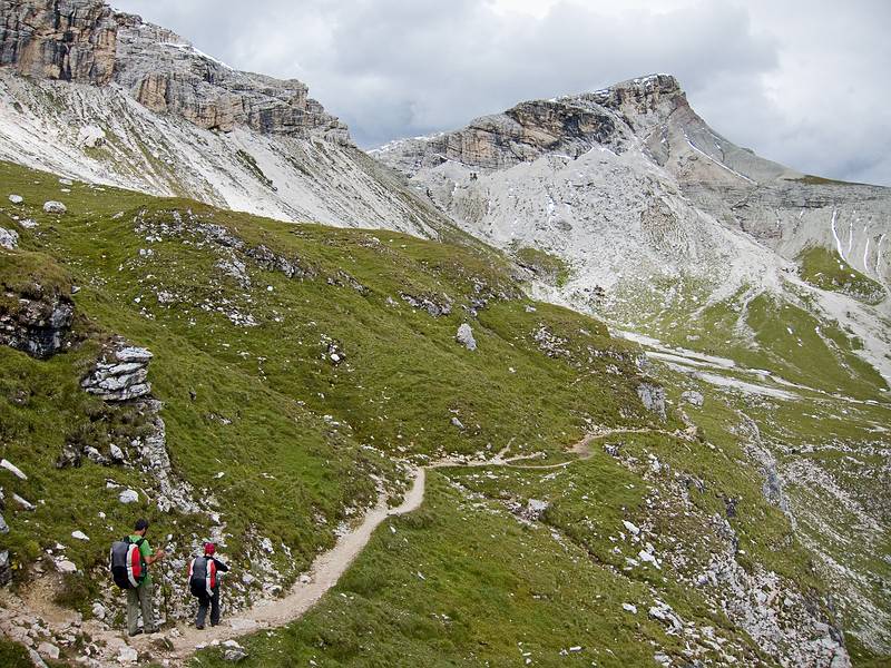 Sati and Melody on trail #2.<br />I am guessing the mountain ahead is Puezkofel (2725 m).<br />Hike from Seceda cable car terminal to Puez hut.<br />July 26, 2011 - NE of St. Ulrich/Ortisei, Italy.