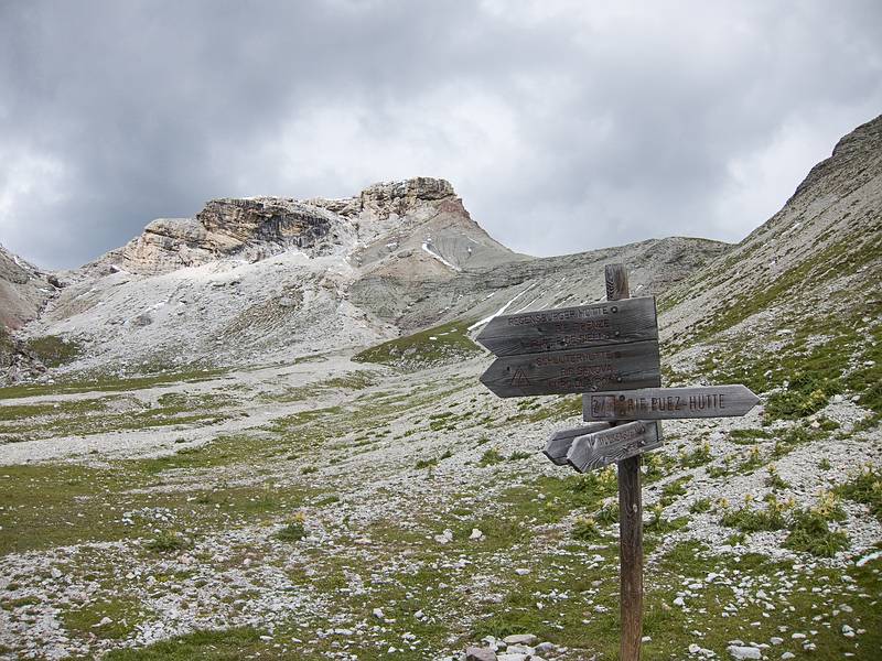 Sign pointing right to our destination.<br />The lower sign points to tomorrow's trail down for Joyce and I.<br />Hike from Seceda cable car terminal to Puez hut.<br />July 26, 2011 - NE of St. Ulrich/Ortisei, Italy.