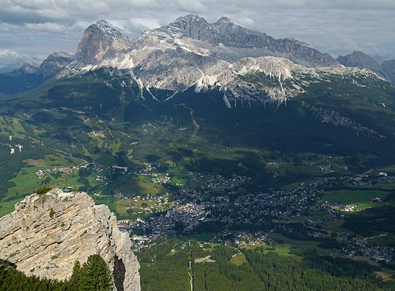 Cortina below with the Tofane group of mountains above it.<br />The highest is Tofana di Mezzo at 3244 m.<br />July 29, 2011 - Above Cortina, at the cable car terminal at Rifugio Faloria.