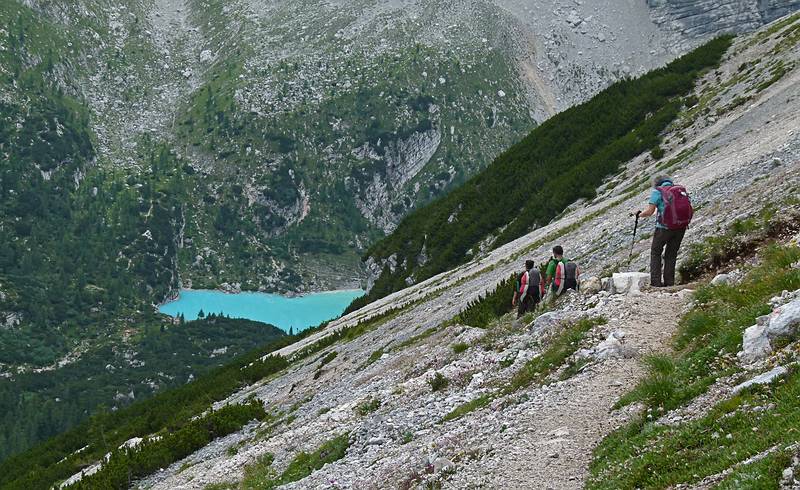 Melody, Sati, and Joyce on trail #216 with the gem of Lake Sorapiss in sight.<br />Hike from cable car terminal at Rifugio Faloria to Rifugio Vandelli near Lake Sorapiss.<br />July 29, 2011 - East of Cortina d' Ampezzo, Italy.