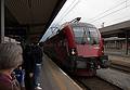 Joyce watches the arrival of our train to Feldkirch.<br />August 1, 2011 - Innsbruck, Austria.