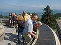 Karl showing Joyce some of the surrounding peaks on the copper plates.<br />The actual peaks cound not be seen due to a heavy haze.<br />August 1, 2011 - Atop the Pfnder above Bregenz, Austria.